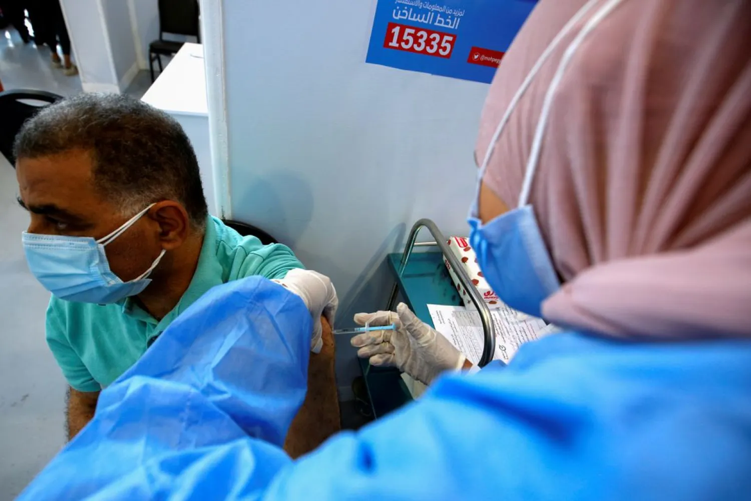 A man receives a dose of the China's Sinopharm vaccine against the coronavirus at a mass immunization venue inside Cairo's International Exhibition Center in Cairo, Egypt June 5, 2021. (Reuters)