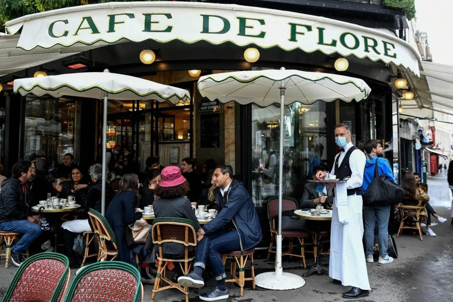 People sit at the terrace of Paris’ landmark Cafe de Flore. AFP