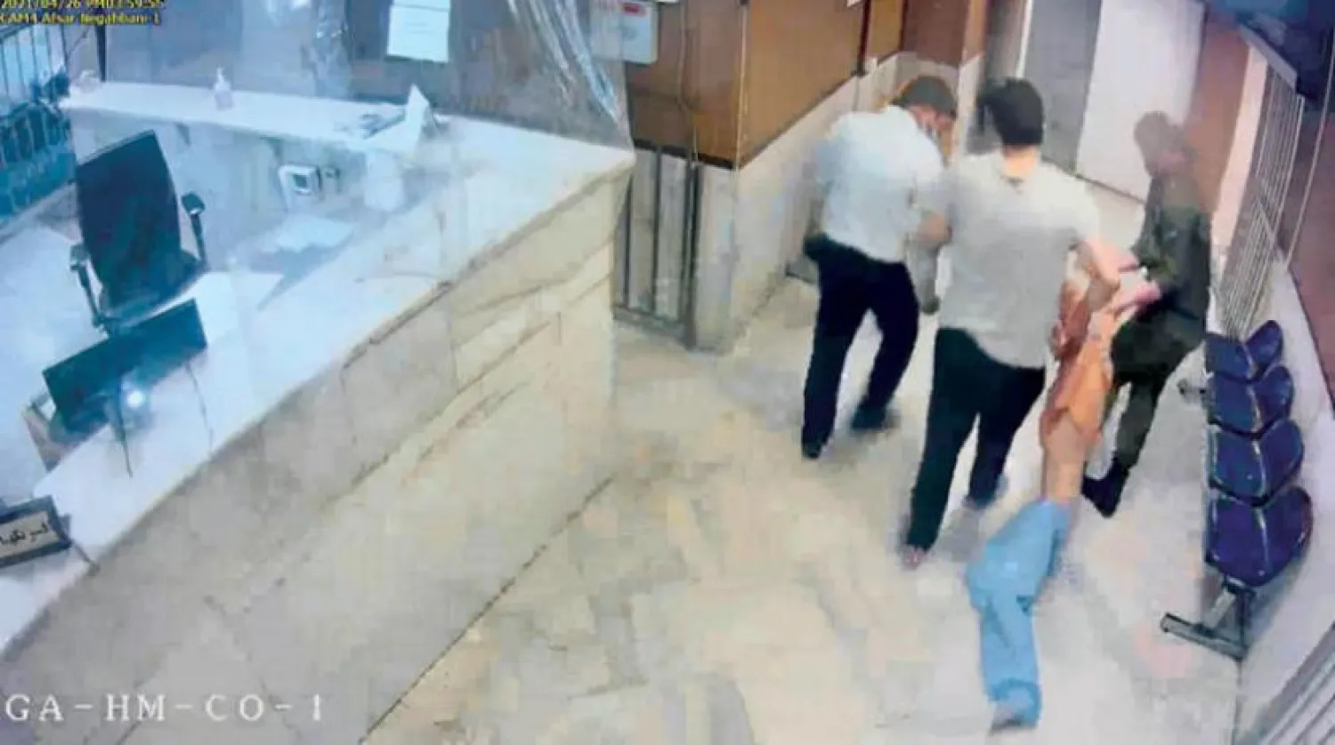 In this undated frame grab taken from video shared with The Associated Press, guards drag an emaciated prisoner, at Evin prison in Tehran, Iran. AP