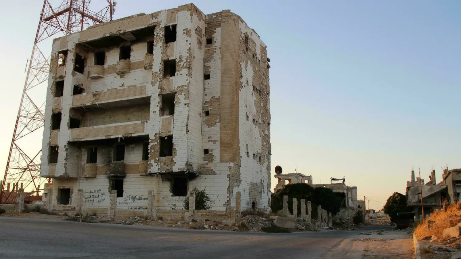 Swathes of the Syrian city of Daraa have been left deserted after heavy fighting between government forces and opposition fighters who stayed on after its return to government control in 2018. (AFP)