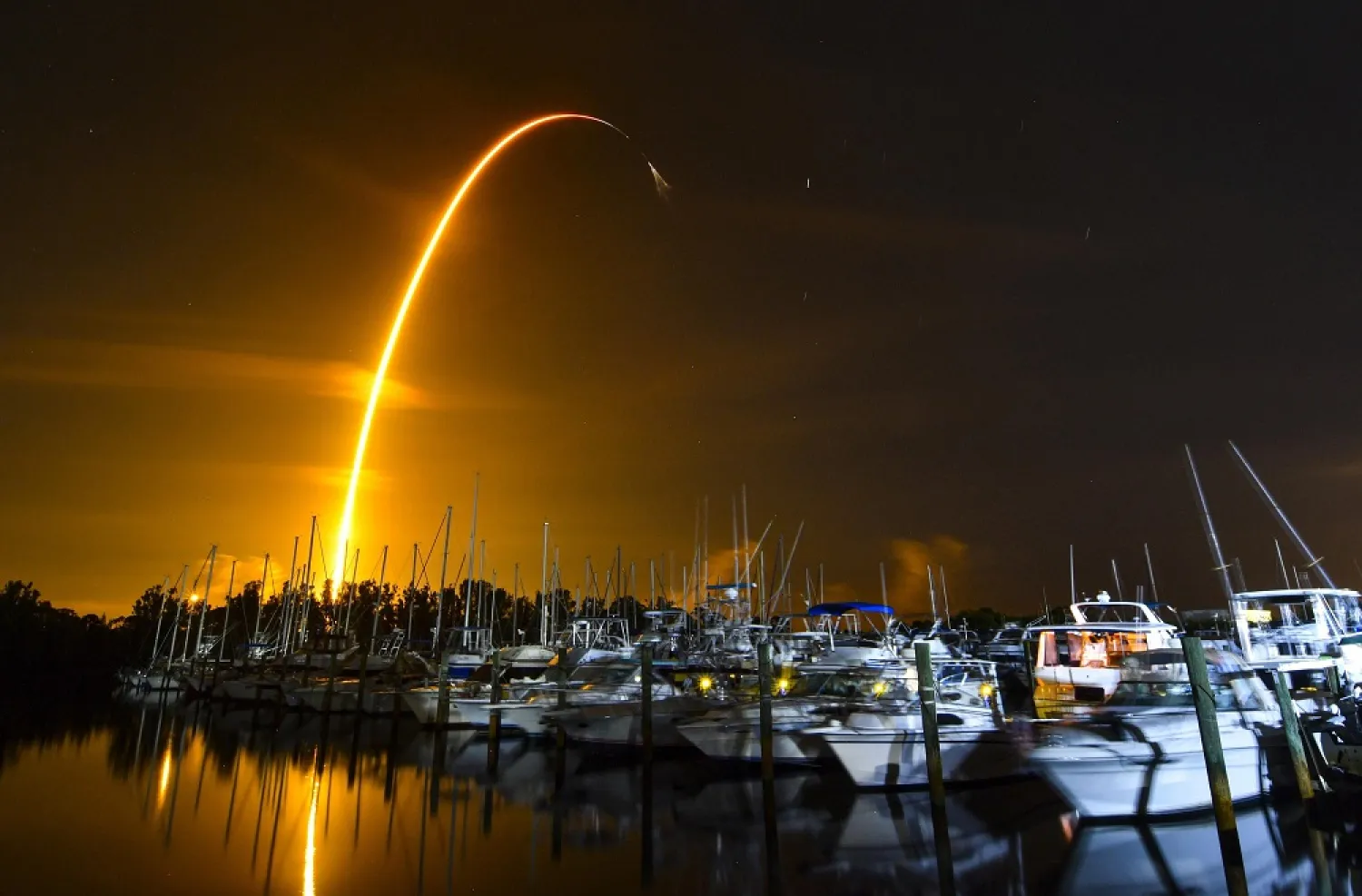 This long exposure photo shows the launch of a SpaceX Falcon 9 rocket on a resupply mission for NASA to the International Space Station from Pad 39A at Kennedy Space Center, seen from Merritt Island, Fla., Sunday, Aug. 29, 2021. (AP)