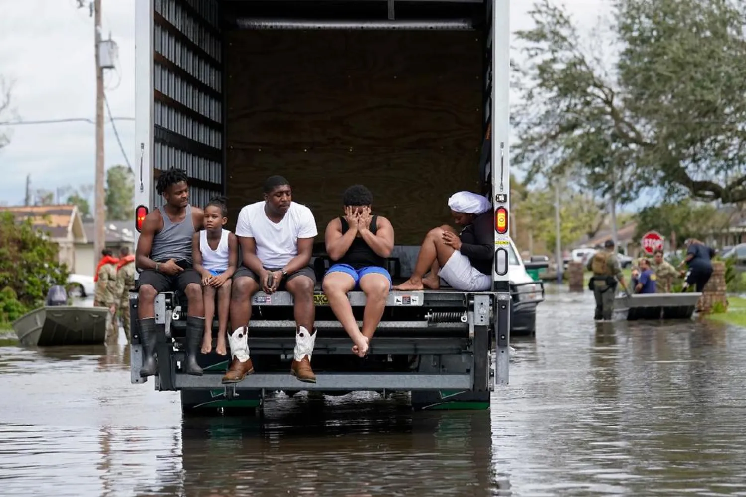 FILE - In this Monday, Aug. 30, 2021, file photo, people are evacuated from floodwaters in the aftermath of Hurricane Ida in LaPlace, La. (AP Photo/Gerald Herbert, File) 