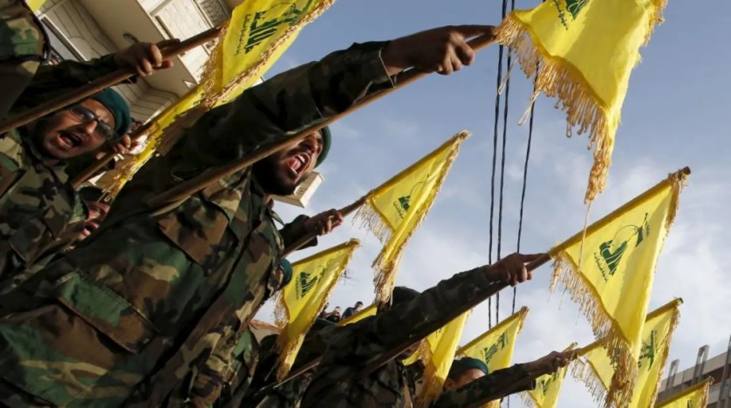 Lebanon’s Hezbollah members carry Hezbollah flags during the funeral of a fellow fighter in al-Ghaziyeh village, southern Lebanon May 26, 2015. REUTERS/Ali Hashisho
