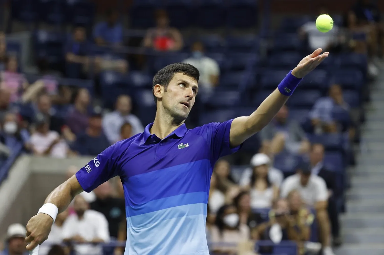 Novak Djokovic serves against Holger Vitus Nodskov Rune in their US Open first-round match, New York, US, Aug. 31, 2021. (Reuters)