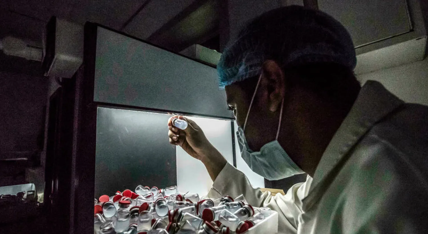 A lab technician holds a vial of China's Sinovac vaccine against the coronavirus, produced by the Egyptian company VACSERA, in the capital Cairo Khaled DESOUKI AFP
