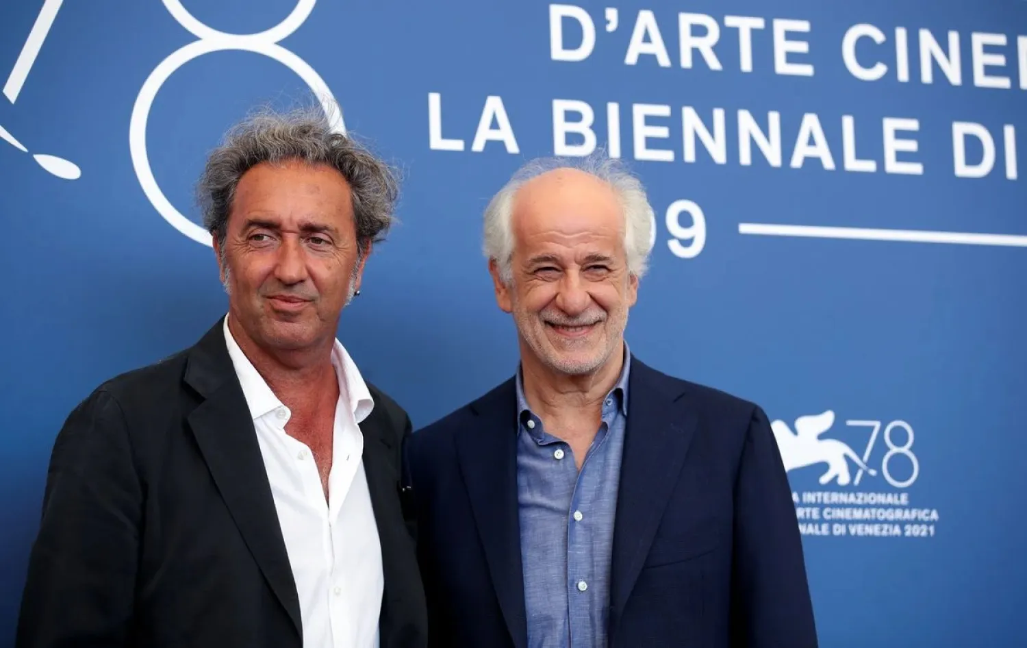 Director Paolo Sorrentino and actor Toni Servillo pose at a photo call at the Venice Film Festival on September 2, 2021. (Reuters)