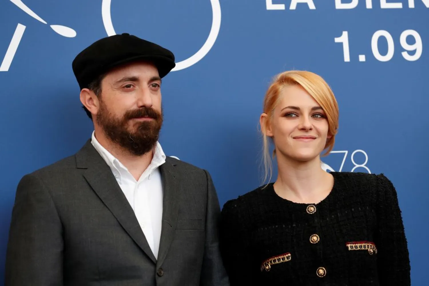 Actor Kristen Stewart and director Pablo Larrain pose at a photo call at the Venice Film Festival. (Reuters)