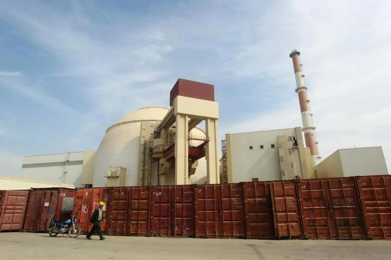 A Russian worker walks past the Bushehr nuclear power plant in Iran, October 26, 2010. REUTERS/Mehr News Agency/Majid Asgaripour
