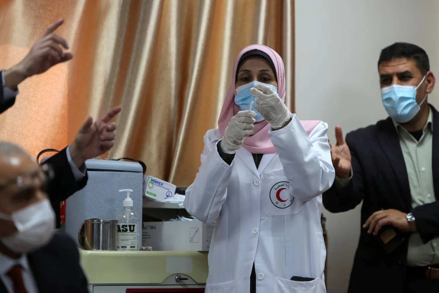 A Palestinian health worker prepares a coronavirus disease (COVID-19) vaccine in Gaza City, February 22, 2021. (Reuters)