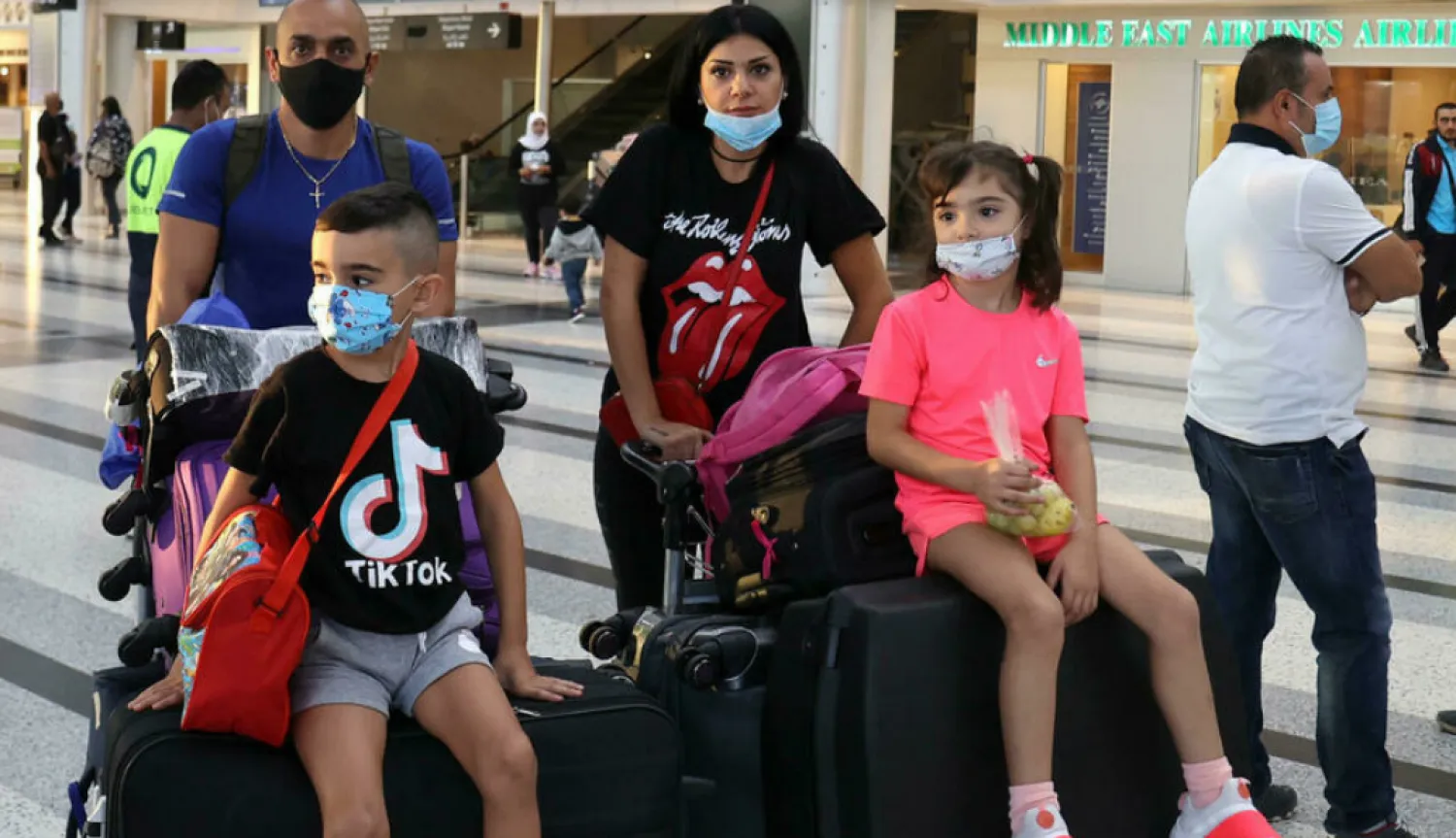 Members of the Abi Haidar family depart from Lebanon's Rafik Hariri International Airport on their way to Cyprus. AFP