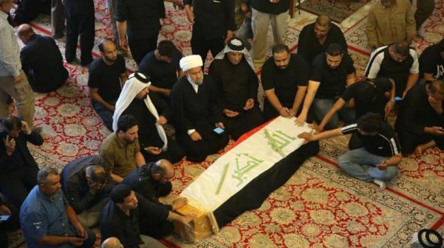 File Photo: Mourners pray during the funeral of a protester killed in Iraq's Najaf. AP photo