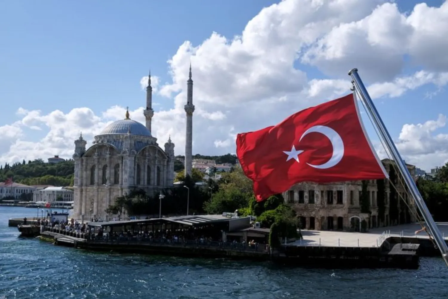 A Turkish flag is pictured on a boat with the Ortakoy Mosque in the background in Istanbul, Turkey September 5, 2021. (Reuters)