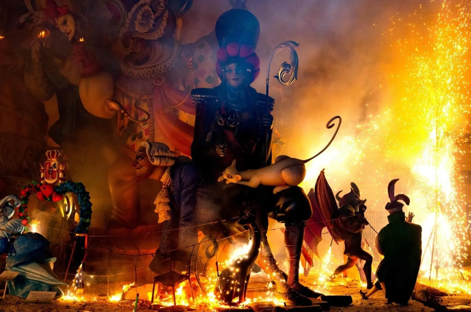 Ninots burn as one installation of the Fallas Festival is set on fire in Valencia, Spain, Sept. 5, 2021. (AFP)