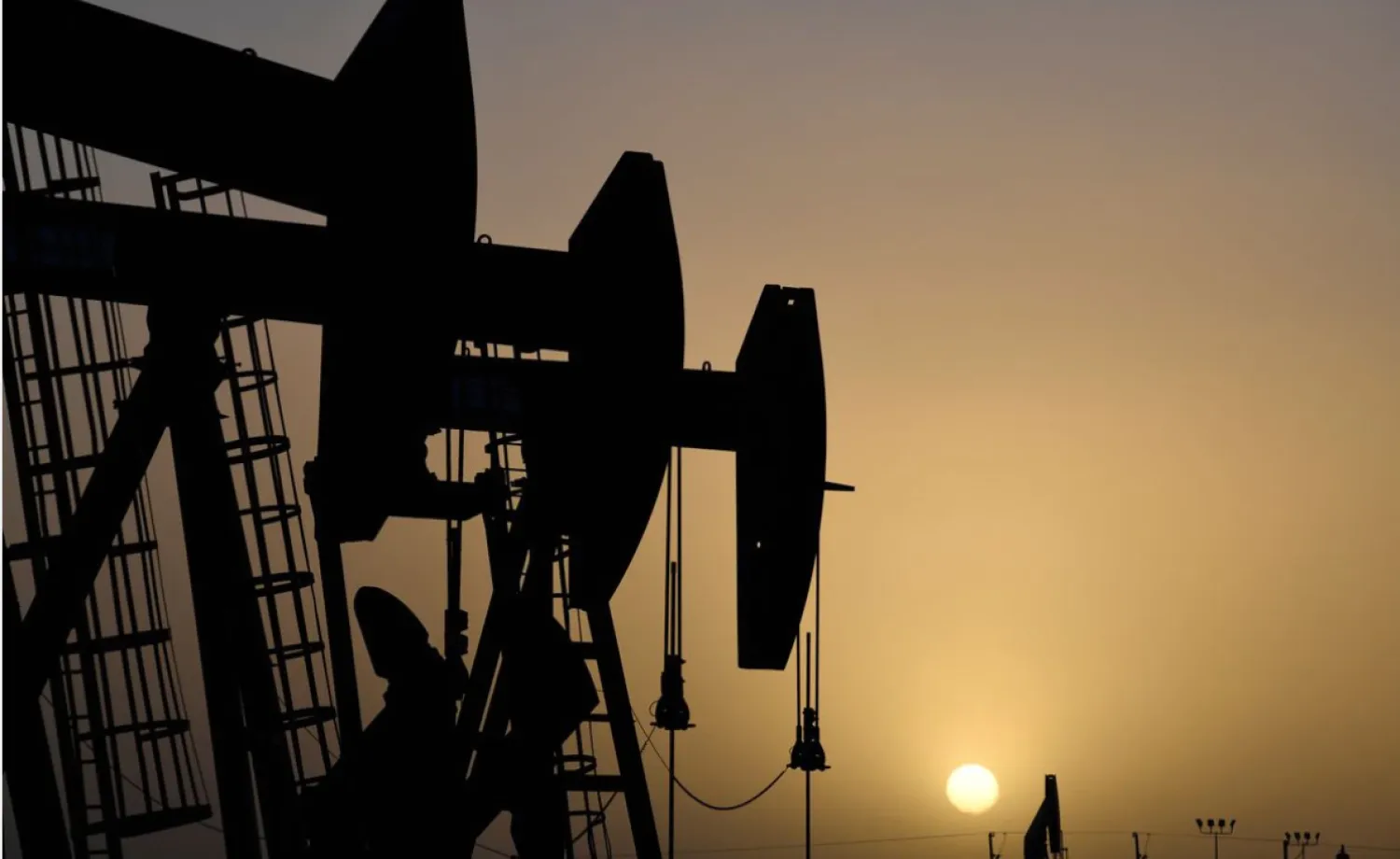 Pump jacks operate at sunset in Midland, Texas, US, February 11, 2019. REUTERS/Nick Oxford