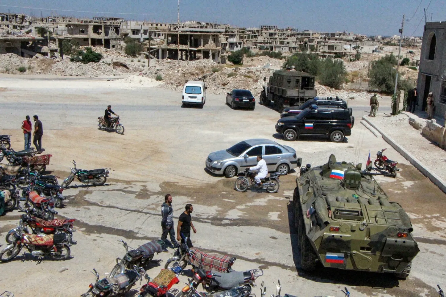 Russian military vehicles are pictured on September 6 in Daraa al-Balad to enforce a ceasefire as part of reconciliation efforts after months of siege by government forces. (AFP)