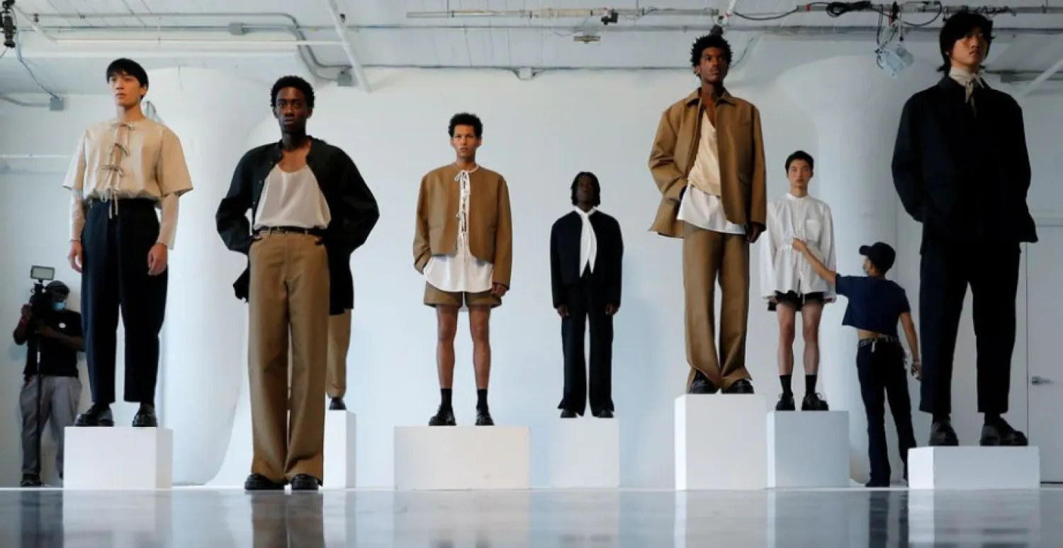 A stylist tends to a model before the presentation of the ONYRMRK Spring/Summer 2022 collection at New York Men's Day during New York Fashion Week in Manhattan, New York City, US, September 8, 2021. REUTERS/Andrew Kelly



