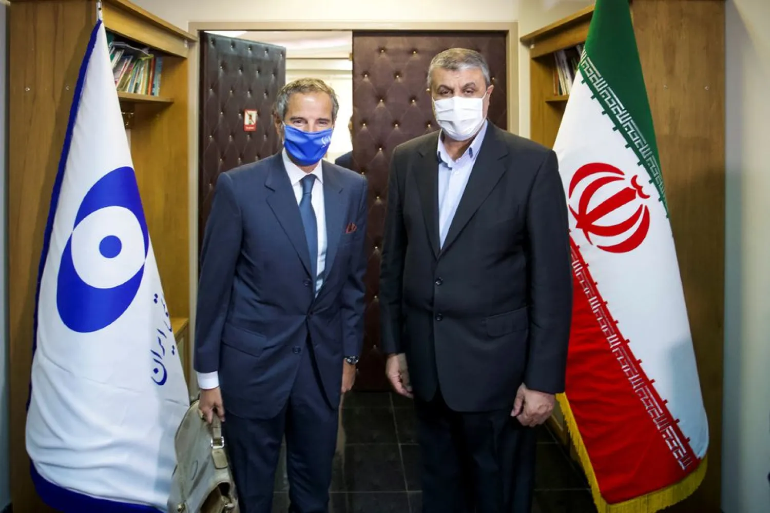 IAEA Director General Rafael Grossi meets with head of Iran’s Atomic Energy Organization Mohammad Eslami, in Tehran, Iran, September 12, 2021. (West Asia News Agency via Reuters)