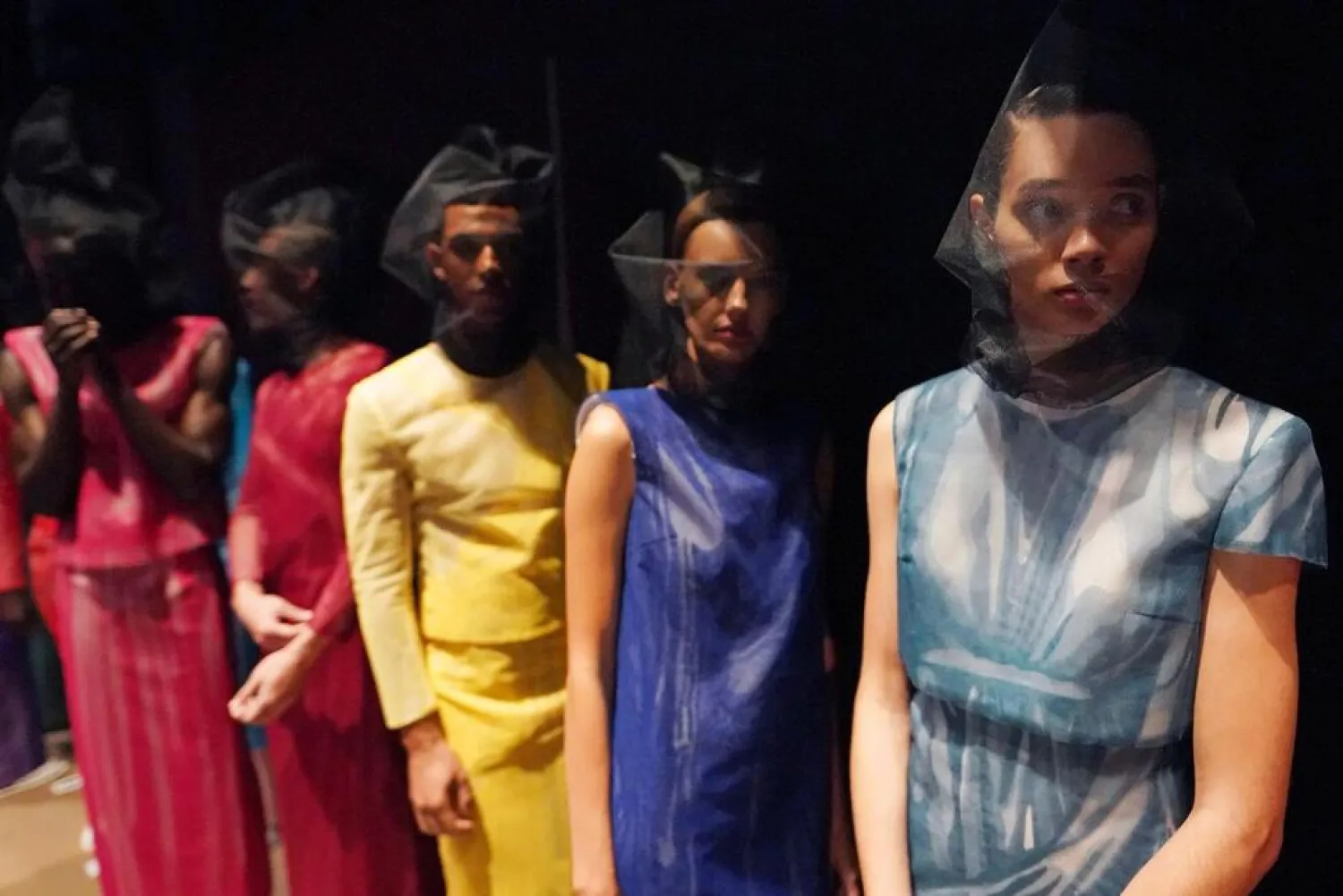 Models appear backstage in preparation for the Thom Browne fashion show during New York Fashion Week at The Shed, on Saturday, Sept. 11, 2021, in New York. (AP)