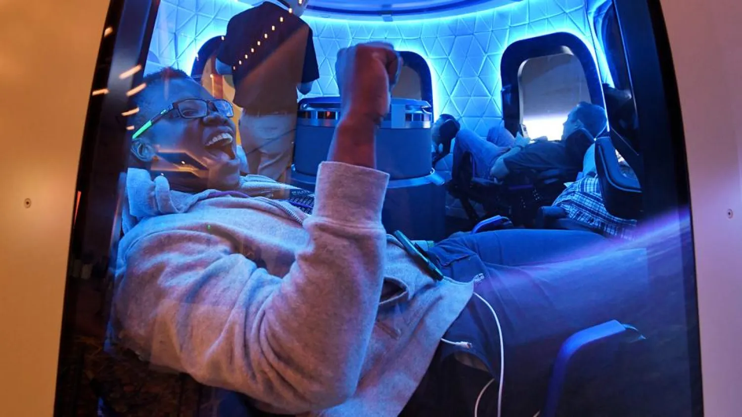 In this file photo taken on June 05, 2019, participants enjoy the Blue Origin Space Simulator during the Amazon Re:MARS conference on robotics and artificial intelligence in Las Vegas, Nevada. (AFP)
