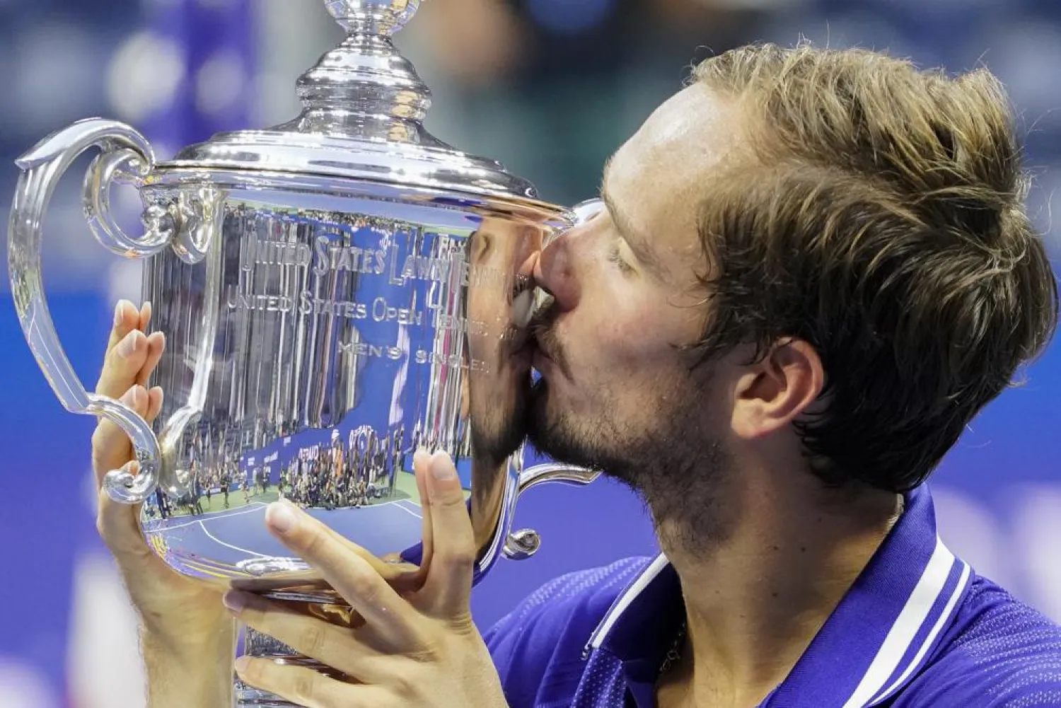 Daniil Medvedev, of Russia, kisses the championship trophy after defeating Novak Djokovic, of Serbia, in the men’s singles final of the US Open tennis championships, Sunday, Sept. 12, 2021, in New York. (AP)