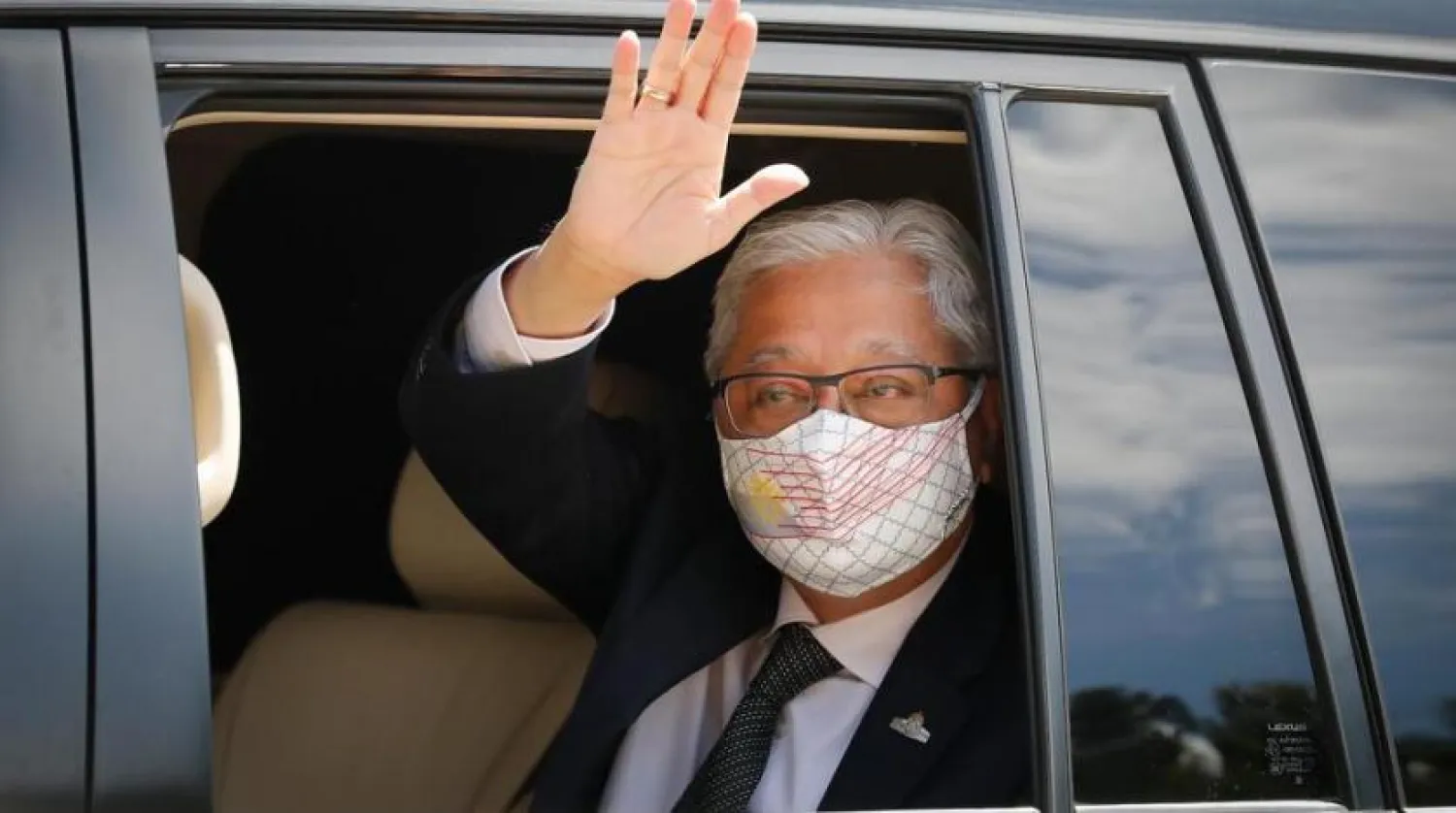 Former Deputy Prime Minister Ismail Sabri Yaakob waves to media as he leave after meeting with the King at national palace in Kuala Lumpur, Malaysia, Thursday, Aug. 19, 2021. (AP)
