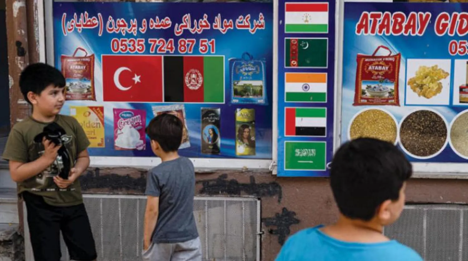 Afghan children play in the street in Istanbul's Zeytinburnu district, on August 27, 2021. (Photo by Yasin AKGUL / AFP)