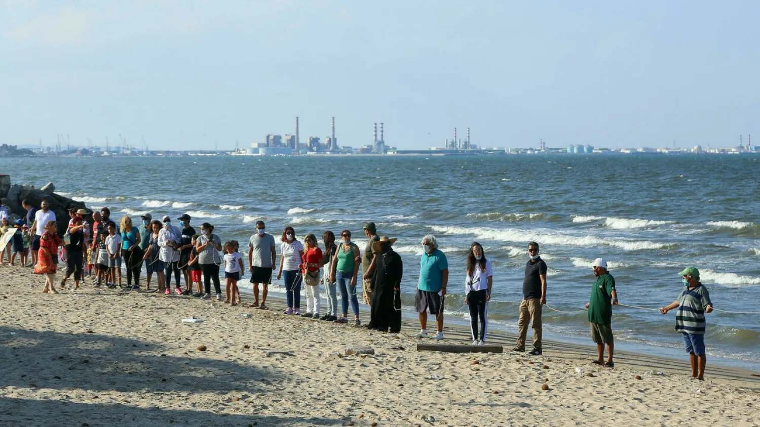 Organizers say some 3,500 people joined Sunday’s protest along Tunisia’s beaches between Rades and Borj Cedria, a 13-kilometer (eight-mile) stretch of sheltered coastline home to around 300,000 people. (AFP)