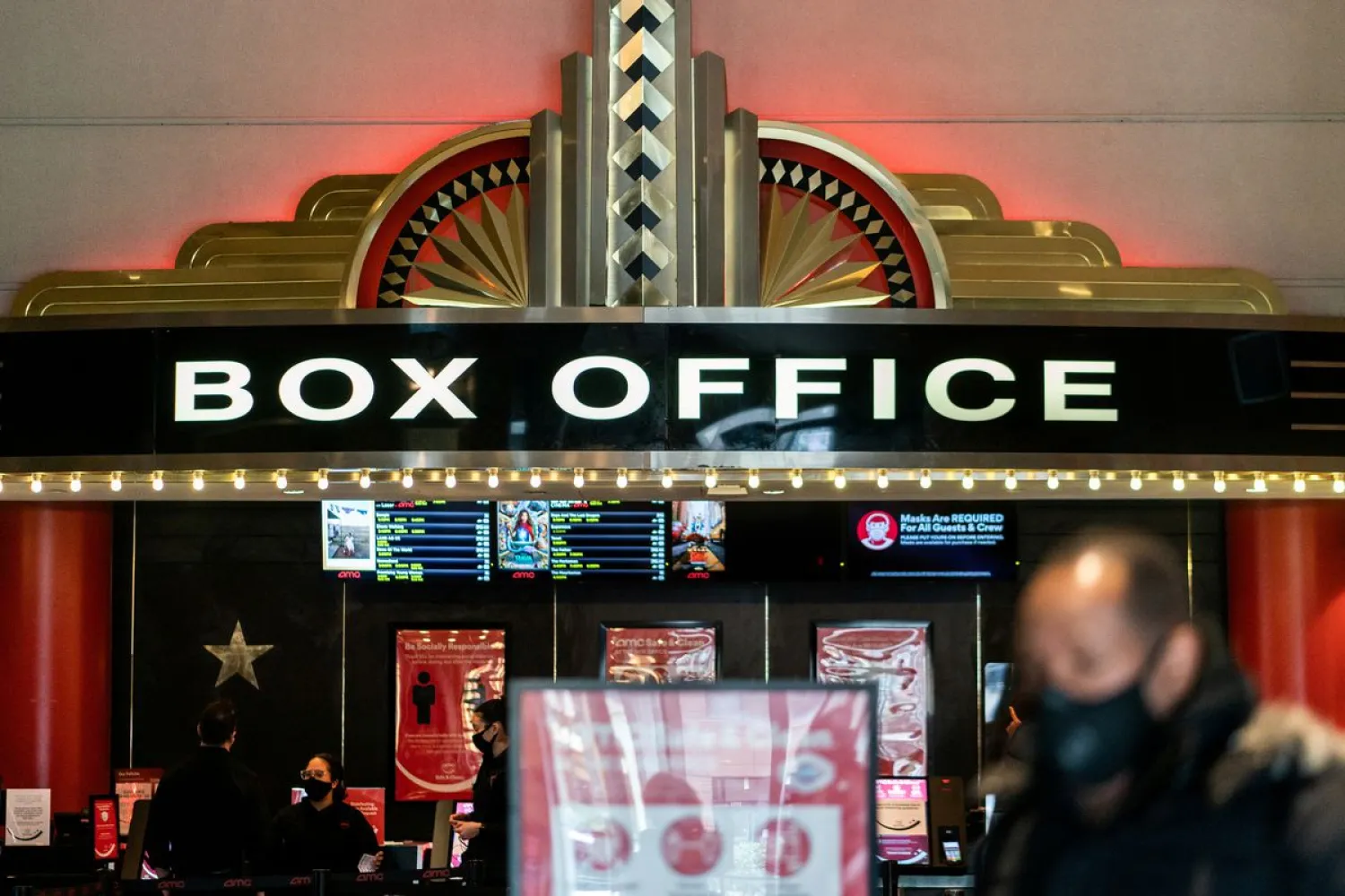 A guest purchases a ticket in front of a box office at AMC movie theatre in Lincoln square. Reuters file photo