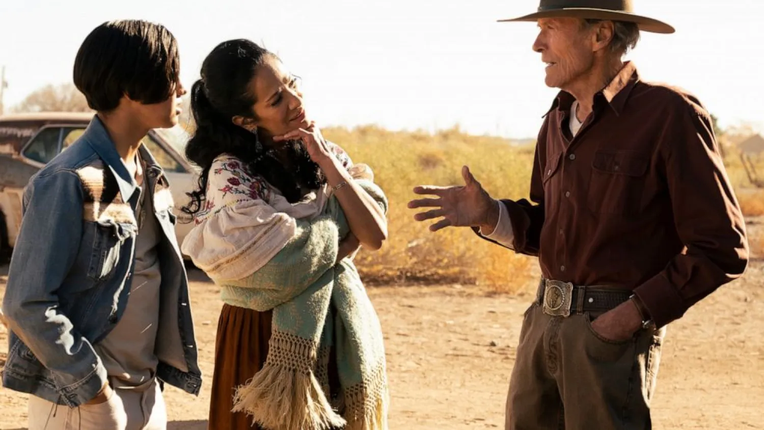 This image released by Warner Bros. Pictures shows Eduardo Minett, from left, Natalia Traven and Clint Eastwood in a scene from “Cry Macho.” (Warner Bros. Pictures via AP)