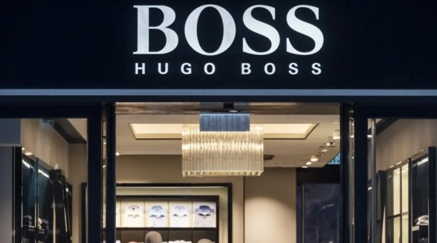 The Hugo Boss logo is seen at one of the brand's stores in Hong Kong. CREDIT: BUDRUL CHUKRUT/AP
