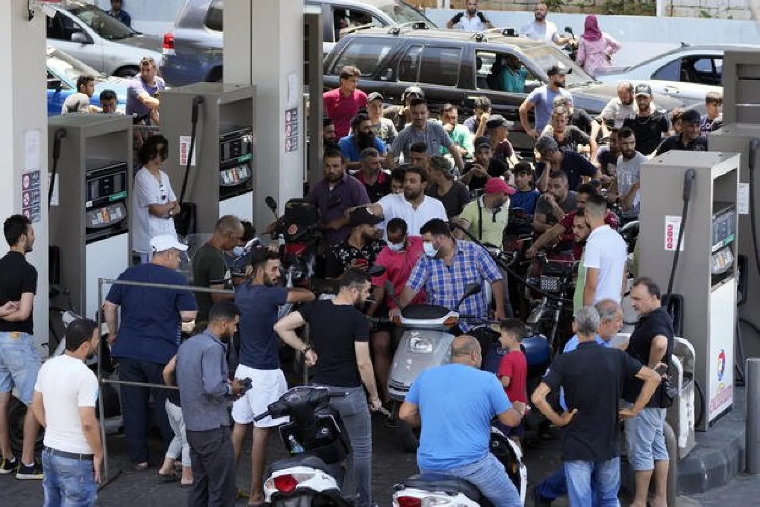 In this June 27, 2021 file photo, motorcycle drivers wait to get fuel at a gas station in a southern suburb of Beirut, Lebanon. (AP Photo/Hassan Ammar, File)
