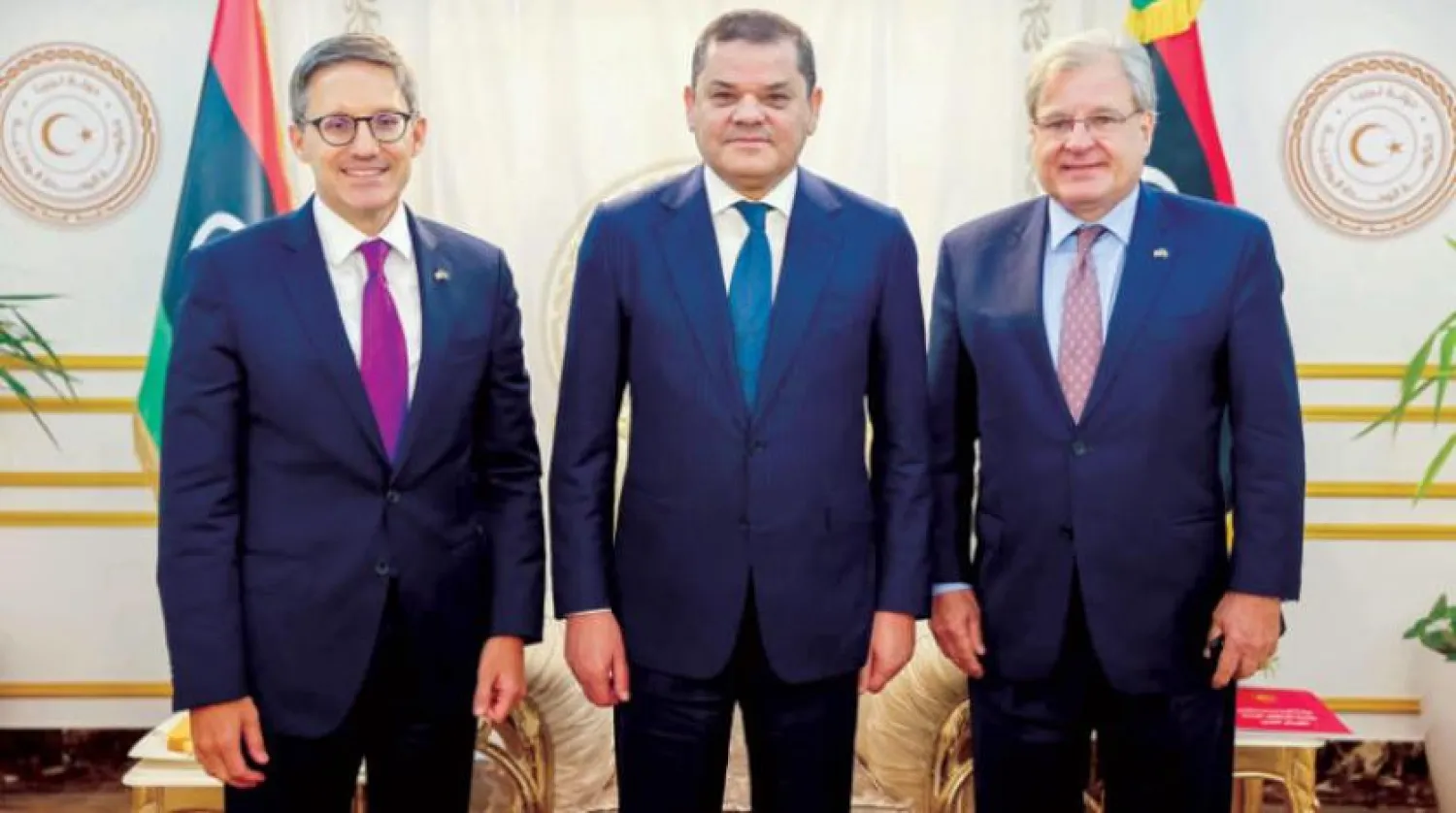 A handout photo made available by the Media Office of the Libyan Prime Minister of the Government of National Unity shows Prime Minister Abdulhamid Dbeibah (C) with Counselor of the US Department of State, Derek Chollet (L) and US Ambassador to Libya Richard Norland (R) during their meeting at his official residence in Tripoli, Libya,15 September 2021. EPA/LIBYAN PRIME MINISTER OFFICE HANDOUT 