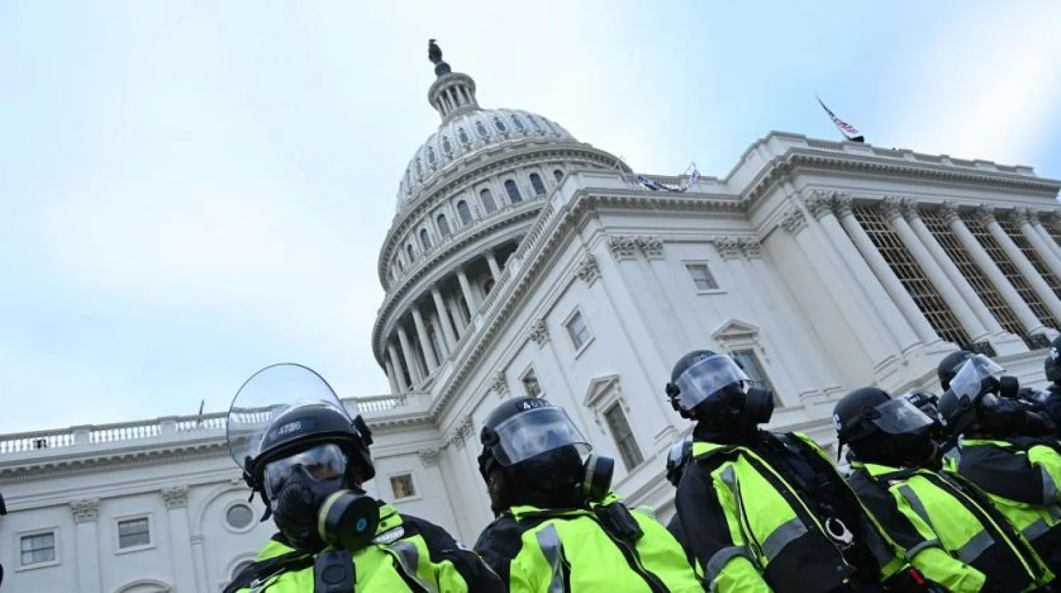 Police stand as supporters of US President Donald Trump protest outside the US Capitol on January 6, 2021, in Washington, DC. (Getty Images)
