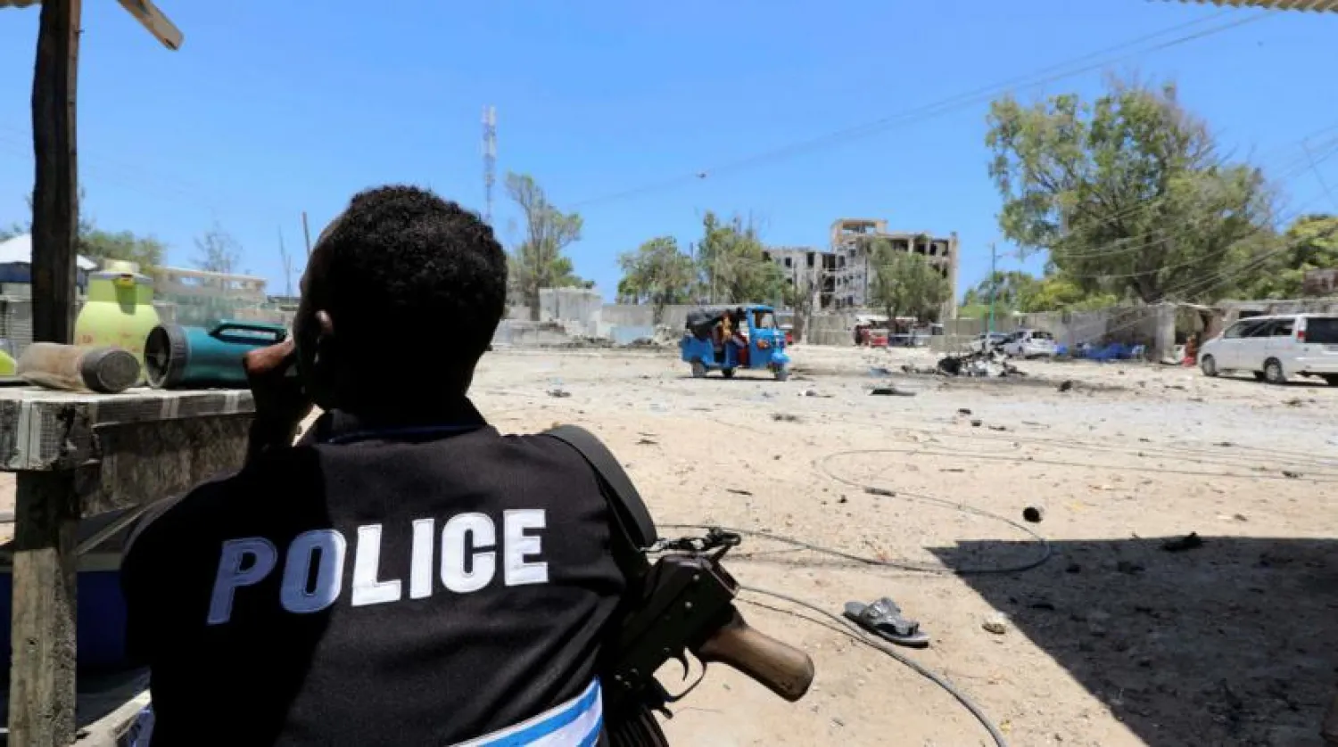 A Somali policeman holds position as al-Shabaab militia storms a government building in Mogadishu, Somalia March 23, 2019. (Reuters)

