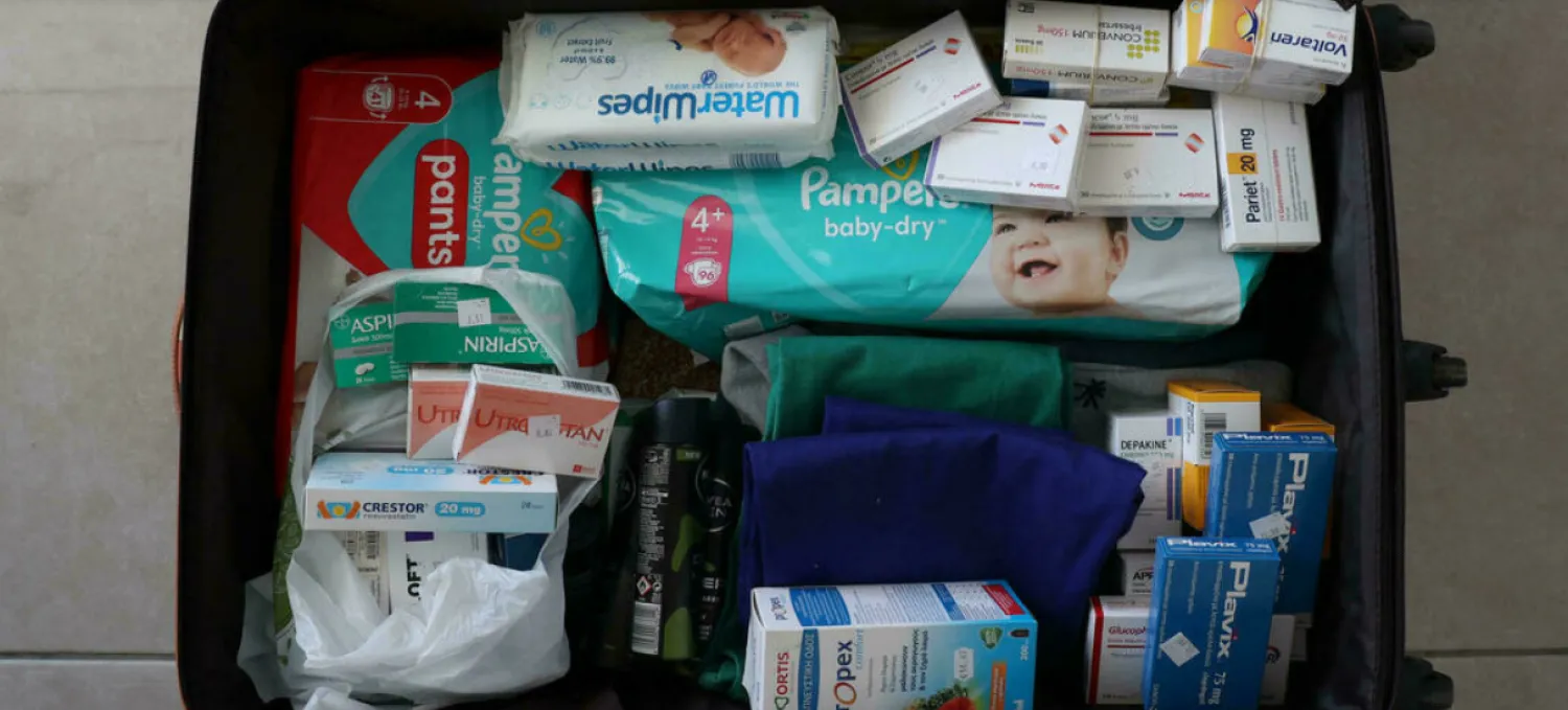 Lebanese expats pack their luggage with supplies including medicine each time they travel to their home country, which is running out of everything. AFP