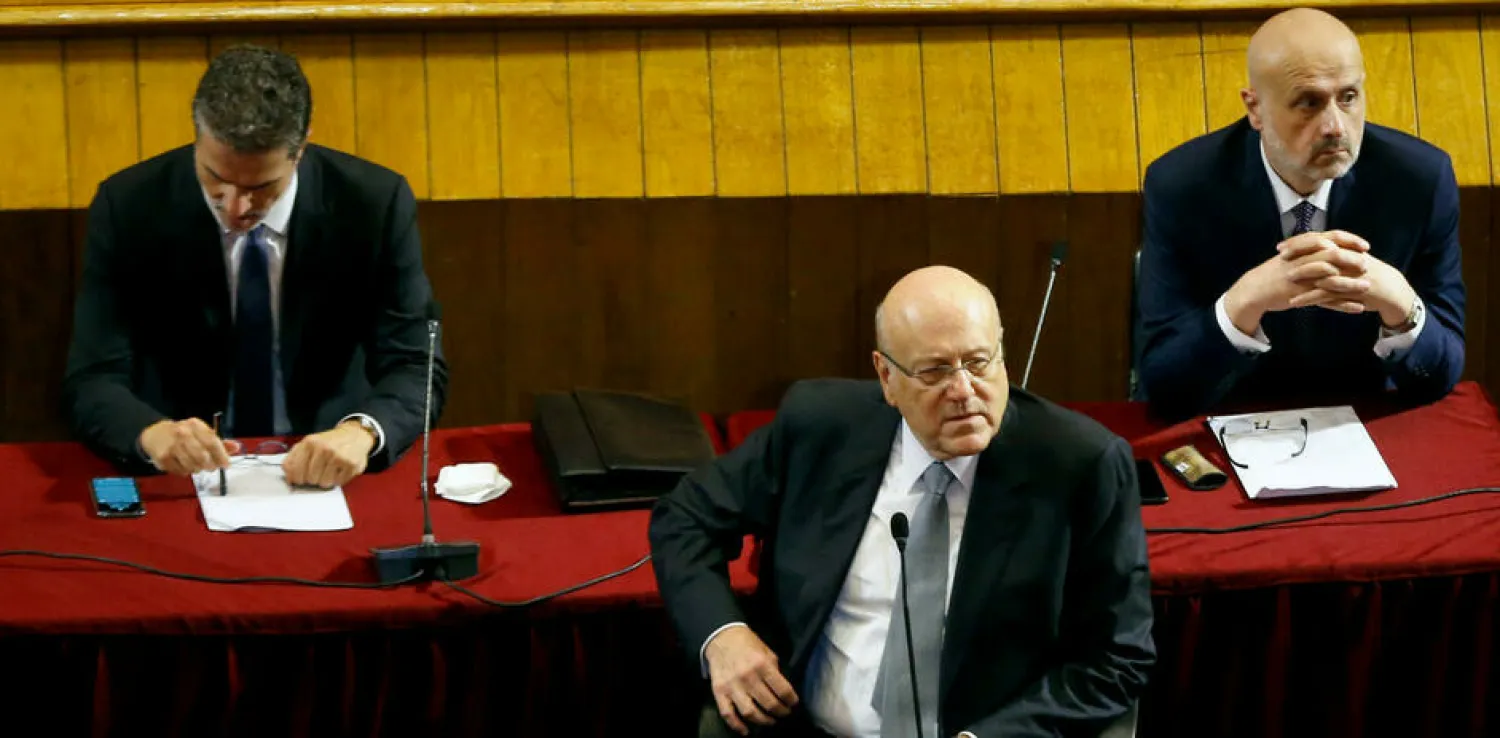 The new cabinet won the vote with a majority of 85 over 15 in a seven-hour parliamentary session interrupted by power cuts. - Bilal Hussein, AP
