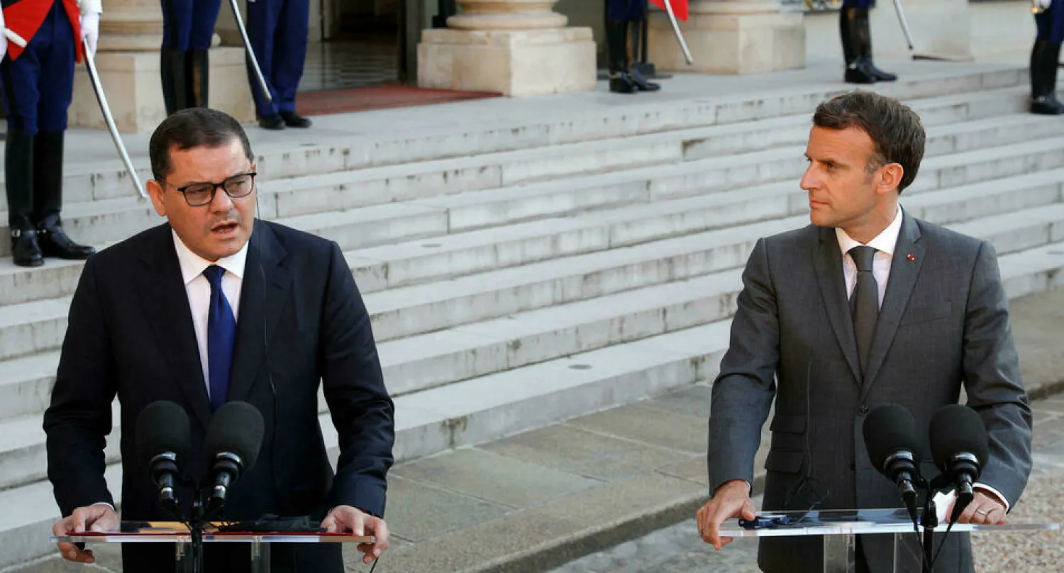 Libya's Interim Prime Minister Abdul Hamid Dbeibah (L) and French President Emmanuel Macron give a speech at the Elysee Palace in Paris, on June 1, 2021 GEOFFROY VAN DER HASSELT AFP/File
