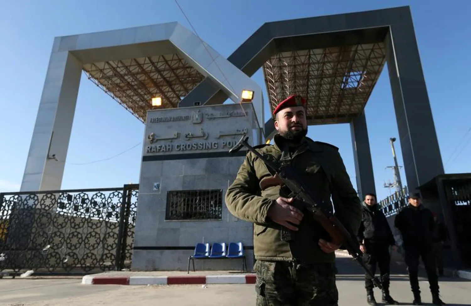 FILE PHOTO: A member of Palestinian security forces loyal to Hamas stands guard at the gate of Rafah border crossing, in the southern Gaza Strip January 7, 2019. REUTERS/Ibraheem Abu Mustafa/File Photo