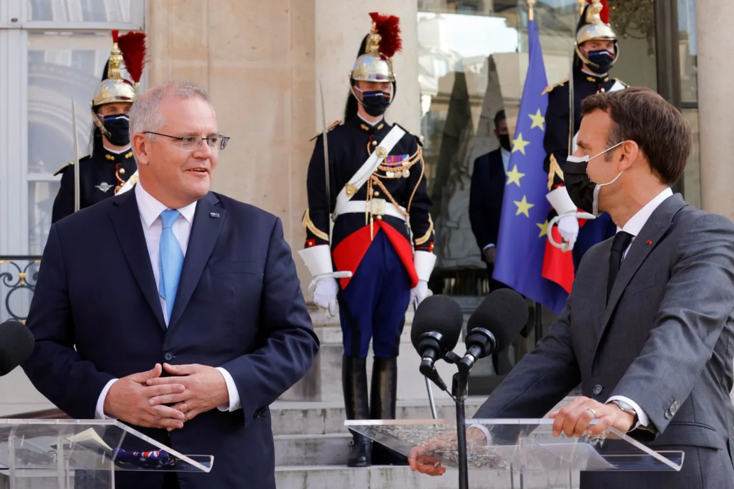 French President Emmanuel Macron and Australian Prime Minister Scott Morrison hold a news conference as they meet at the Elysee Palace in Paris, France, June 15, 2021. (Reuters)