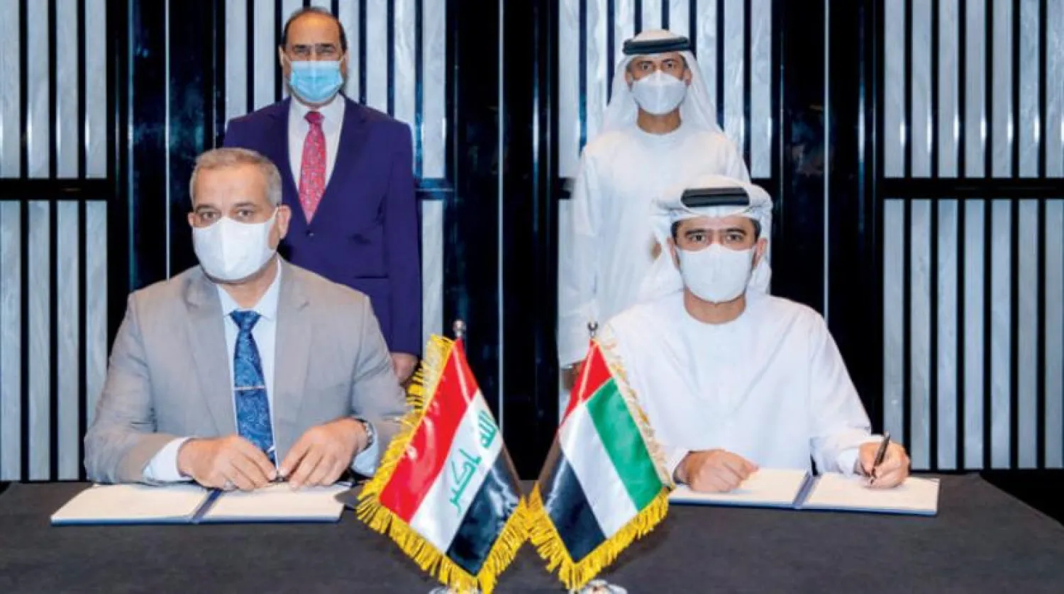 The signing of a memorandum of understanding between Emirati and Iraqi officials on Monday (Asharq Al-Awsat)