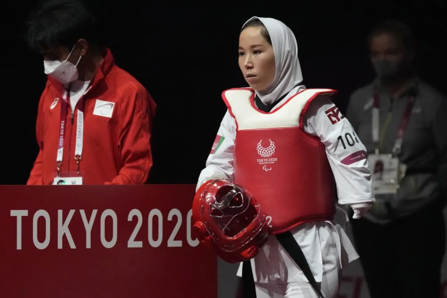 Afghanistan's Zakia Khudadadi enters the arena during her women's K44 49kg Taekwondo match against Ziyodakhon Isakova of Uzbekistan at Tokyo 2020 Paralympic Games, Thursday, Sept. 2, 2021, in Chiba, east of Tokyo, Japan. (AP Photo/Shuji Kajiyama)
