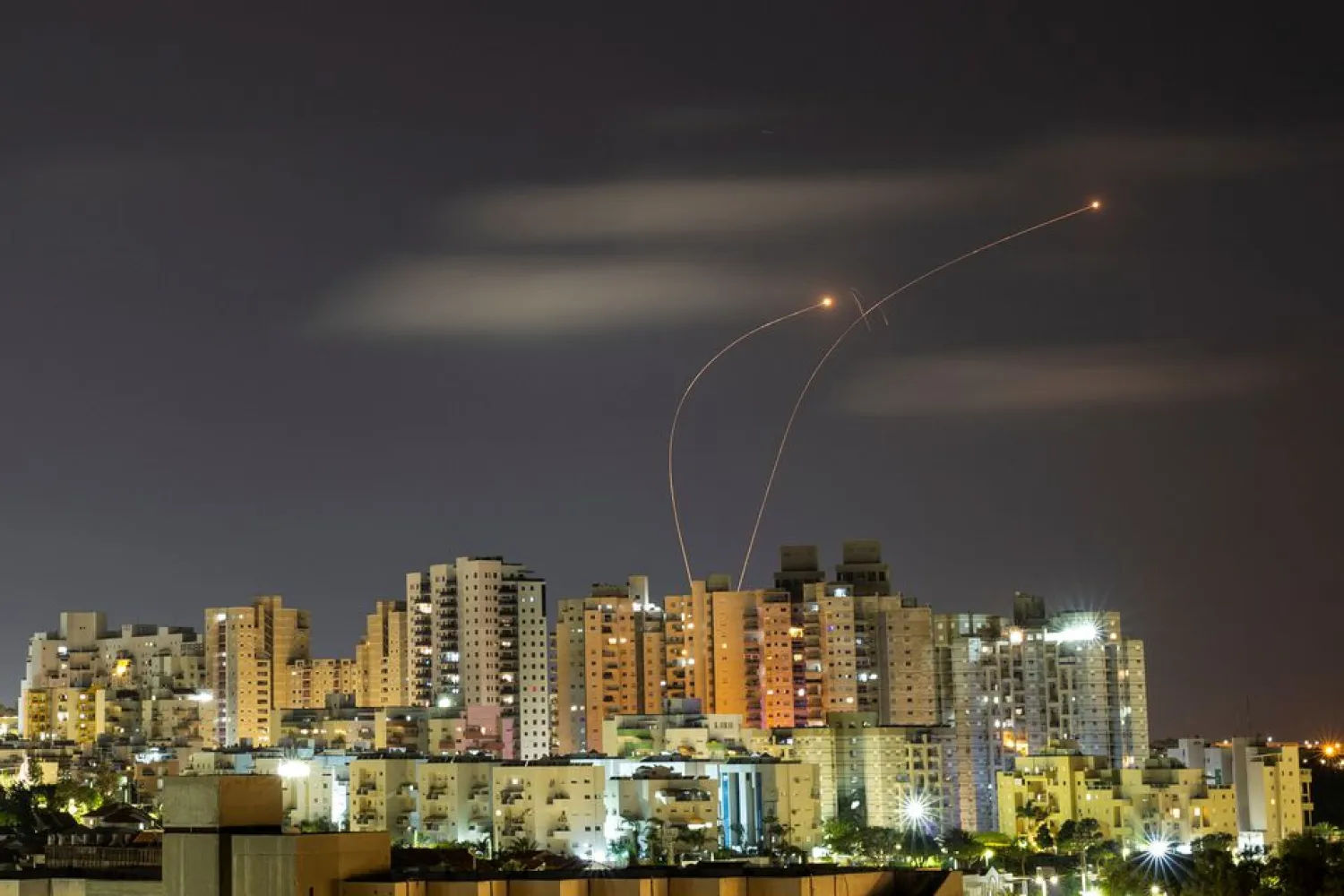 Streaks of light are seen as Israel's Iron Dome anti-missile system intercepts rockets launched from the Gaza Strip towards Israel, as seen from Ashkelon May 20, 2021 REUTERS/ Amir Cohen/File Photo

