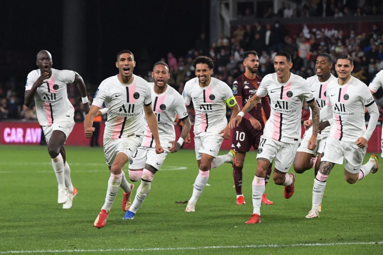 Paris Saint-Germain's Achraf Hakimi (2L) celebrates with teammates after scoring his team's second goal against Metz at the Saint-Symphorien Stadium in Longeville-les-Metz. - AFP PIC
