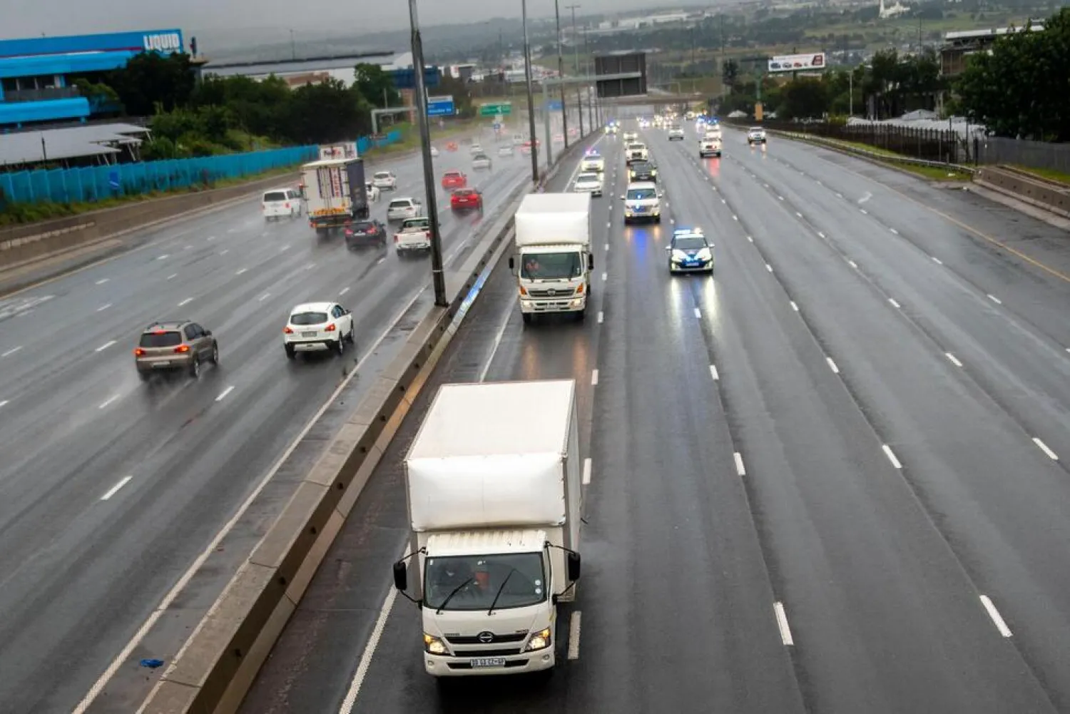 South African law enforcement vehicles provide security for two refrigeration trucks transporting the AstraZenica vaccine that arrived earlier from India, near Johannesburg, Monday, Feb. 1, 2021.  (Photo by Alet Pretorius) THE ASSOCIATED PRESS


