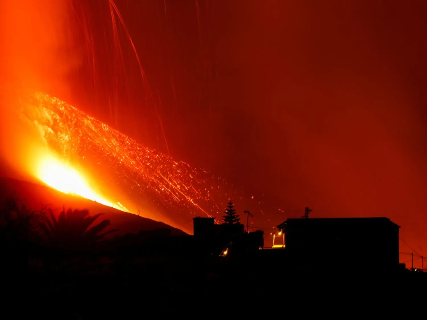 Lava and smoke rise after a volcano erupts on the Canary Island of La Palma in El Paso, Spain on September 25, 2021. (Reuters)