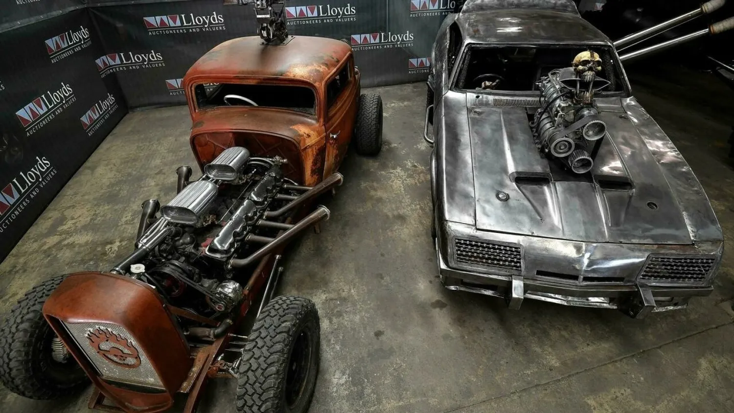 The Elvis (L) and Razor Cola convoy cars are just two of several outlandish vehicles used in the 2015 dystopian blockbuster film “Mad Max: Fury Road”, which are up for bids at Lloyds Auctions in Sydney. (AFP)