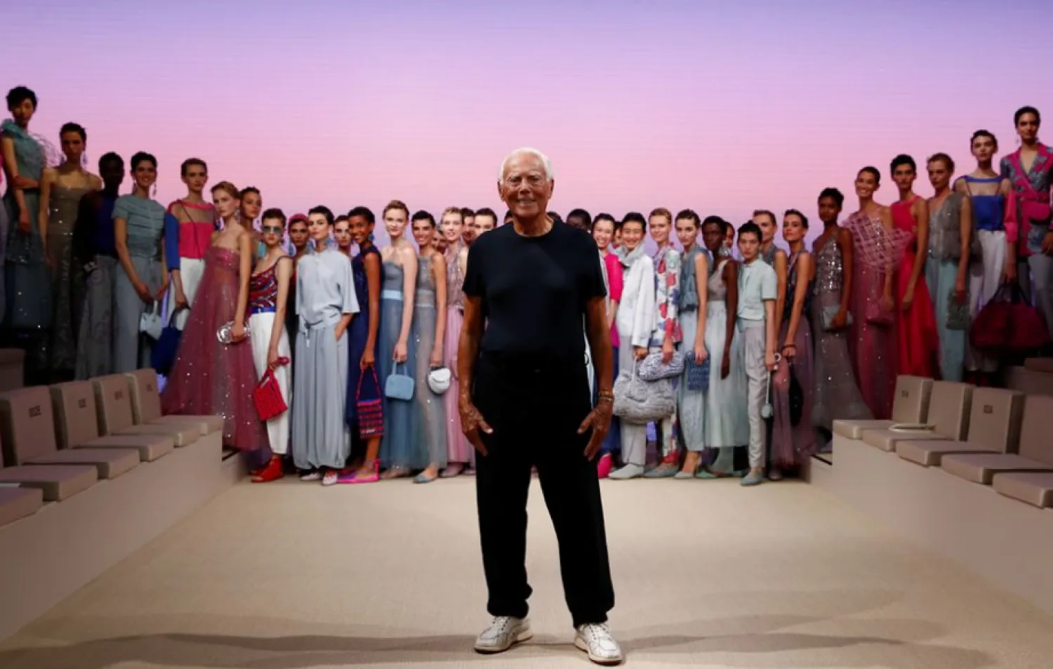 Designer Giorgio Armani appears with models at the end of the Giorgio Armani Spring/Summer 2022 collection during Milan Fashion Week in Milan, Italy, September 25, 2021. REUTERS/Alessandro Garofalo


