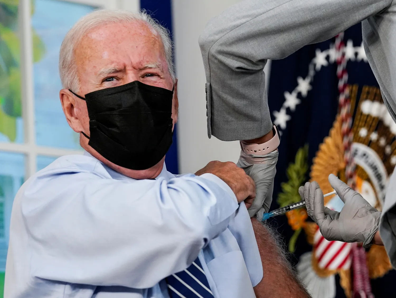 US President Joe Biden receives his coronavirus disease (COVID-19) booster vaccination in the Eisenhower Executive Office Building's South Court Auditorium at the White House in Washington, US, September 27, 2021. REUTERS/Kevin Lamarque