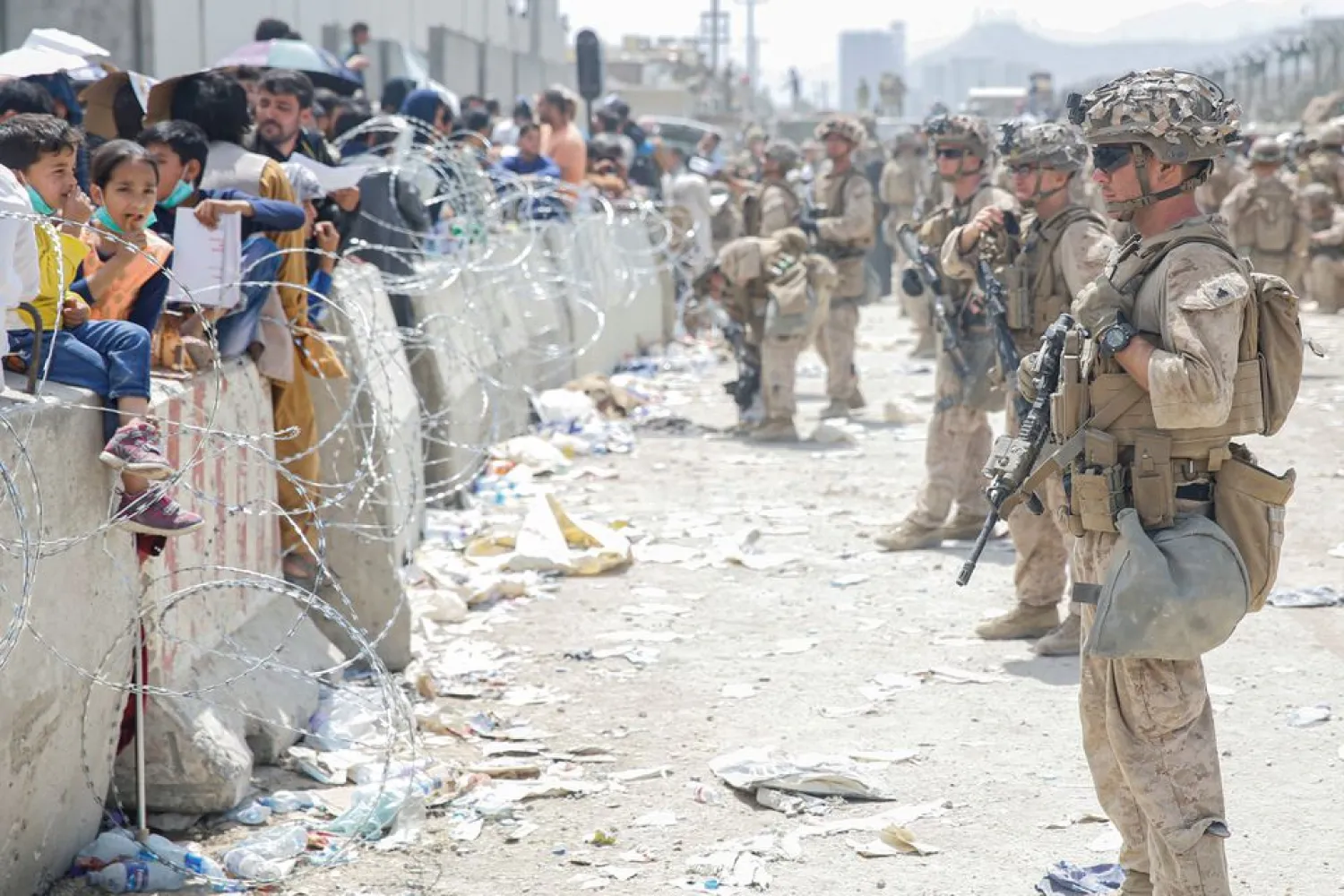 US Marines provide assistance during an evacuation at Hamid Karzai International Airport, in Kabul, Afghanistan, August 20, 2021. Lance Cpl. Nicholas Guevara/US Marine Corps/via Reuters