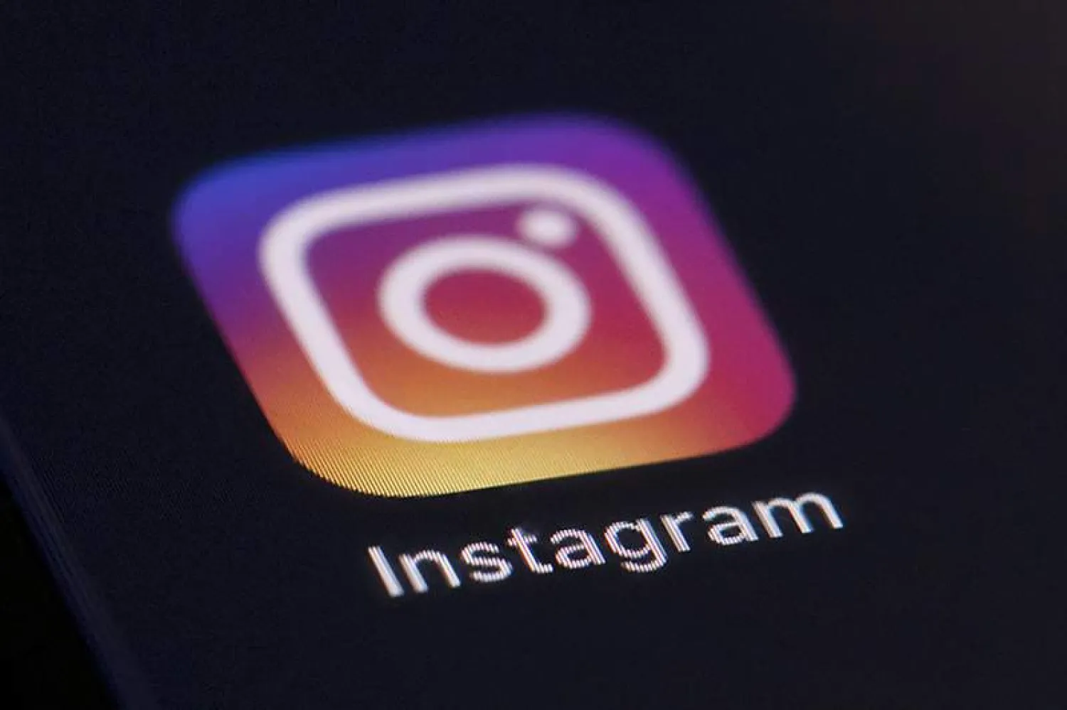 File photo shows the Instagram app icon on the screen of a mobile device in New York. (AP Photo/Jenny Kane, File) 
